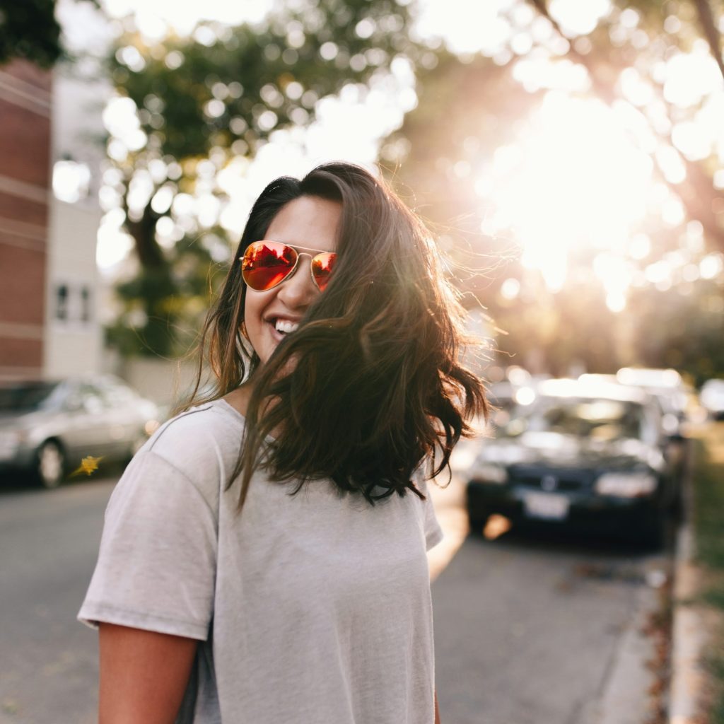 hungarian woman wearing white T-shirt smiling