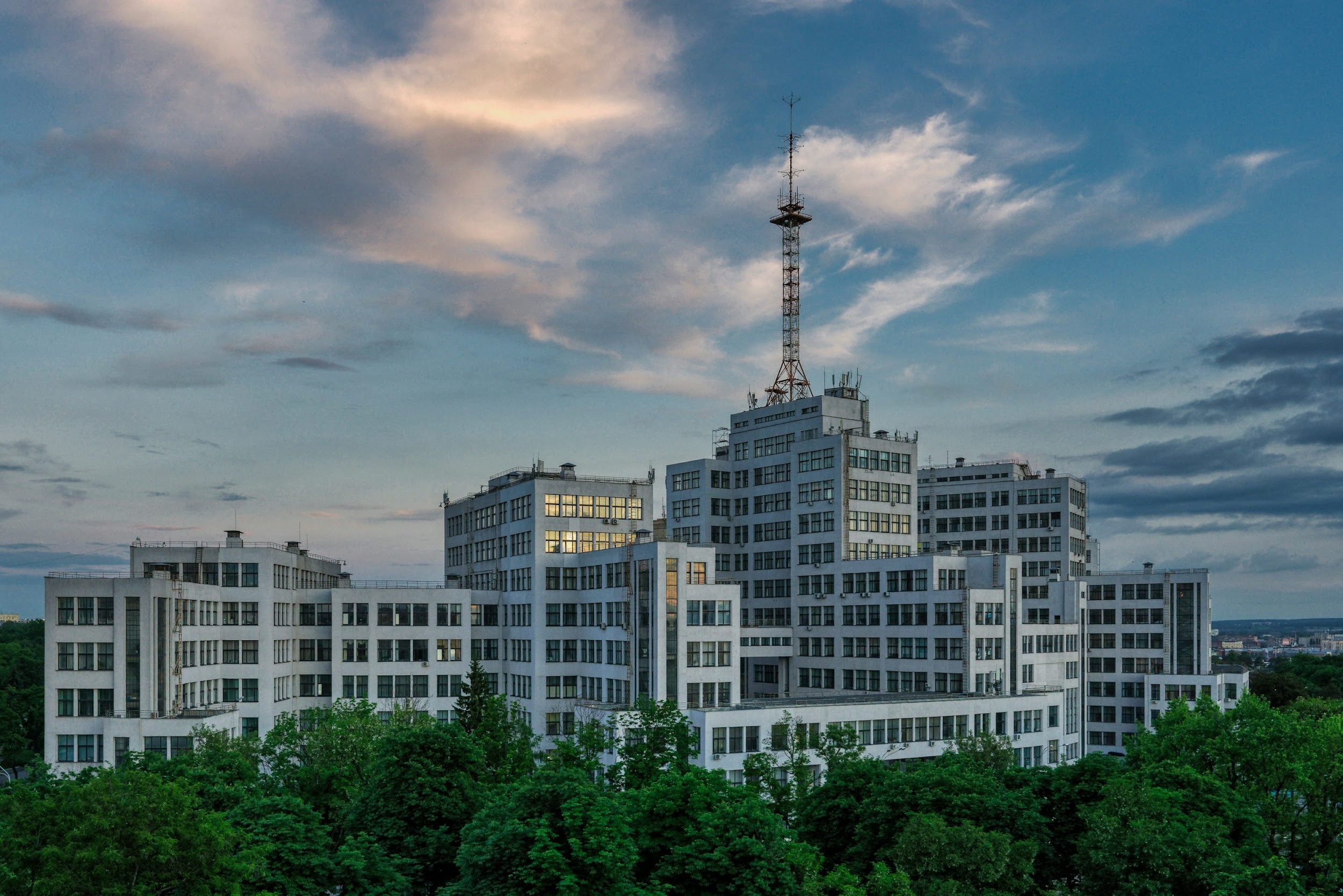 kharkiv white and brown concrete building near green trees under cloudy sky during daytime