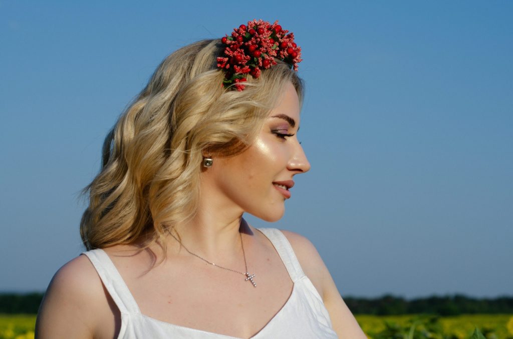 a woman standing in a field of sunflowers